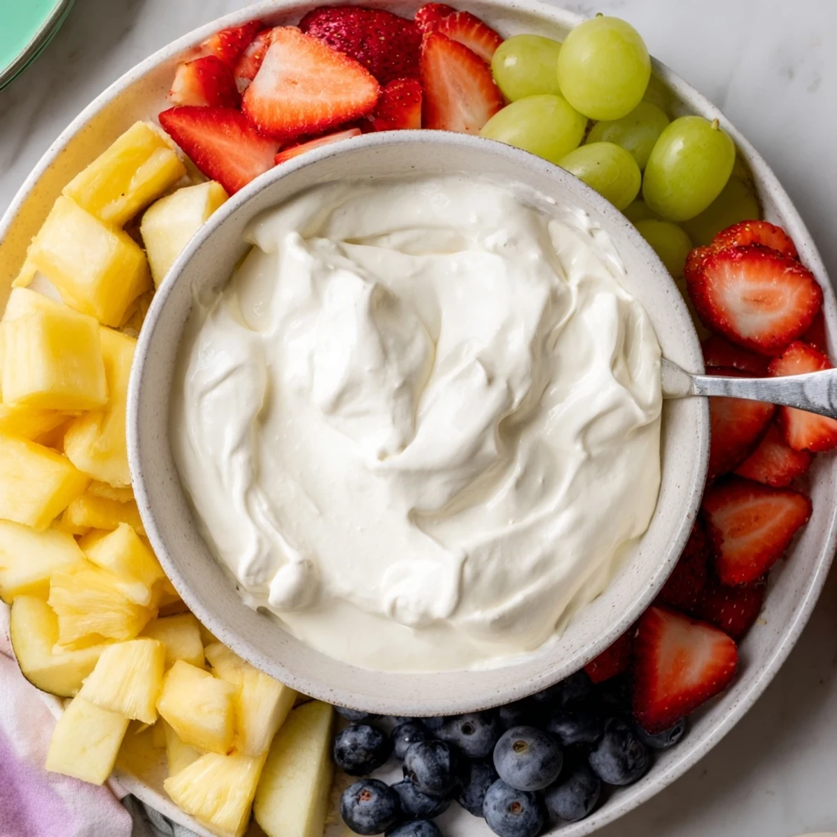 A sweet and easy cream cheese fruit dip, ideal for dipping apple slices and strawberries.