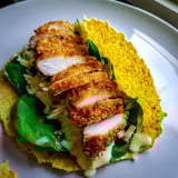 Imagine a vibrant, savory Chicken Piccata Crunch Wrap with a melted cheese interior.