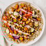 This wholesome Roasted Chickpea Buddha Bowl features fluffy rice, creamy tahini, and flavorful roasted ingredients.