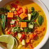 This flavorful Lentil Red Curry Soup shows vibrant vegetables in a creamy coconut broth, ready to eat.