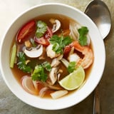Vibrant image of Spicy Tom Yum Soup, showcasing plump shrimp and bright red chili peppers.