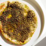 Freshly baked Levantine Zaatar Bread boasts a crispy crust and fragrant zaatar topping alongside sesame.
