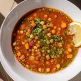 A delicious close-up showcases the rich spices and hearty vegetables in the Harira Soup.