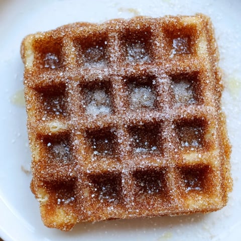 Golden-brown Express Cinnamon Sugar Churro Waffles, dusted with sweet cinnamon and sugar, ready to enjoy.