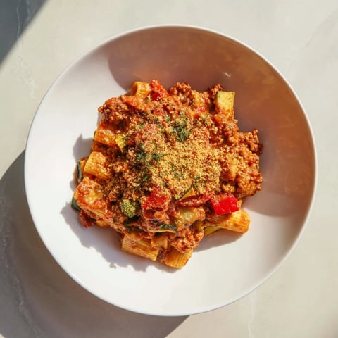 Spicy Vegan Chorizo Baked Pasta, bubbling with melted vegan cheese and a rich tomato sauce, ready to serve.