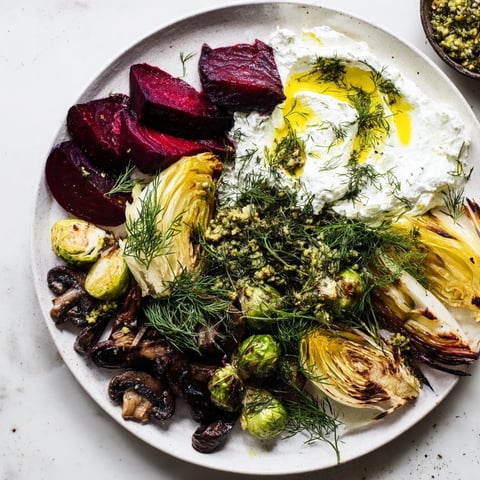 A vibrant Pine Forest Winter Mezze Board, showcasing roasted vegetables and creamy labneh for a holiday feast.