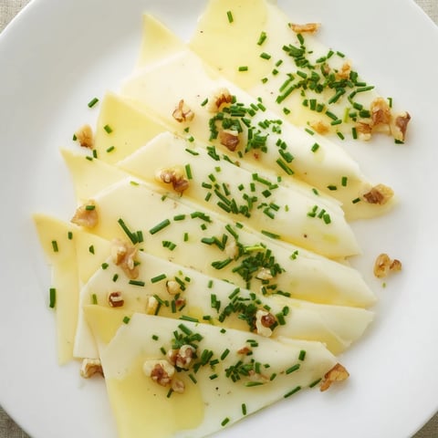 Artfully arranged Swiss cheese slices, forming a fan for a delectable appetizer display on the platter.