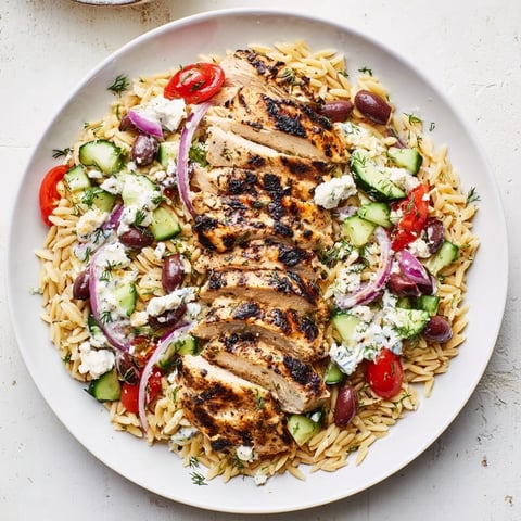 Golden grilled Greek Chicken Gyro Pasta Bowls, offering a medley of fresh flavors and tangy feta.