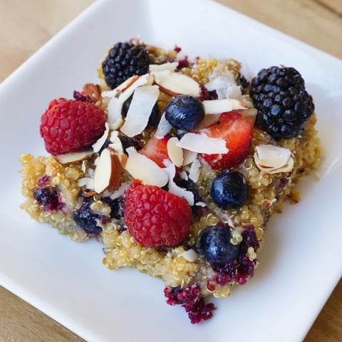Warm Berry Quinoa Breakfast Bake with golden crust, a delightful mix of berries and quinoa.