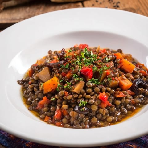 Hearty and flavorful Abuela's Secret Lentil Stew with Prunes featuring tender lentils and sweet prunes.