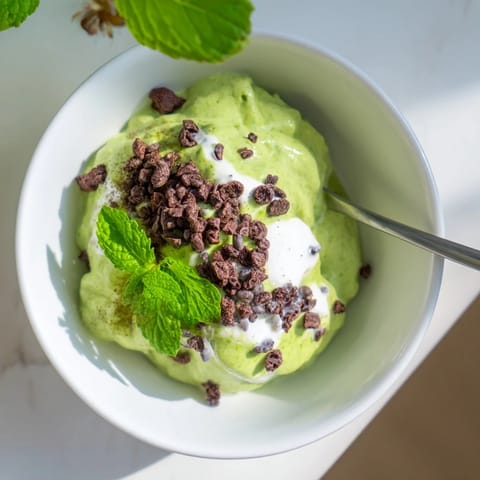 Smooth, vibrant Grinch Green Mint Matcha Breakfast Chia Pudding topped with crunchy cacao nibs makes a delicious breakfast.