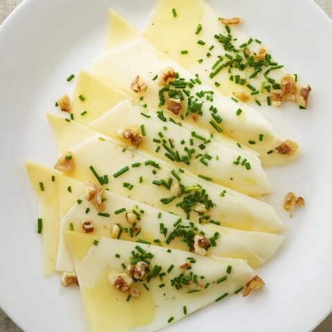 Artfully arranged Swiss cheese slices, forming a fan for a delectable appetizer display on the platter.