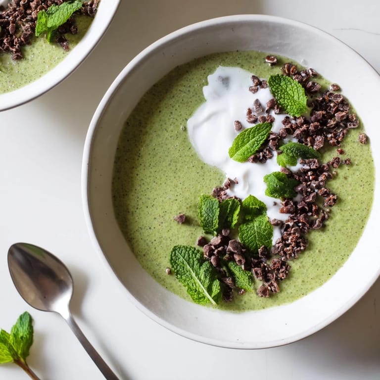 Enjoy a spoonful of creamy Grinch Green Mint Matcha Breakfast Chia Pudding, perfect for a festive and healthy breakfast.