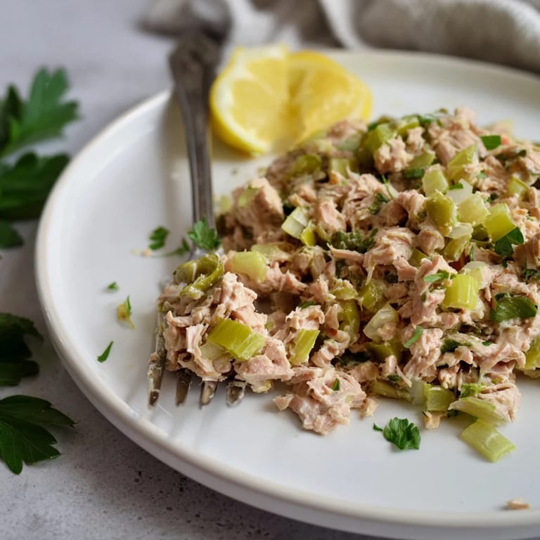 Zesty tuna salad with a spicy kick, served in crisp lettuce cups for a light, refreshing low-carb meal idea.