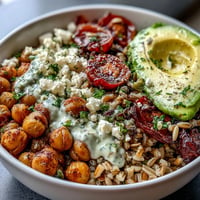 Colorful Ancient Grains Bowl with chickpeas and creamy lemon tahini dressing.
